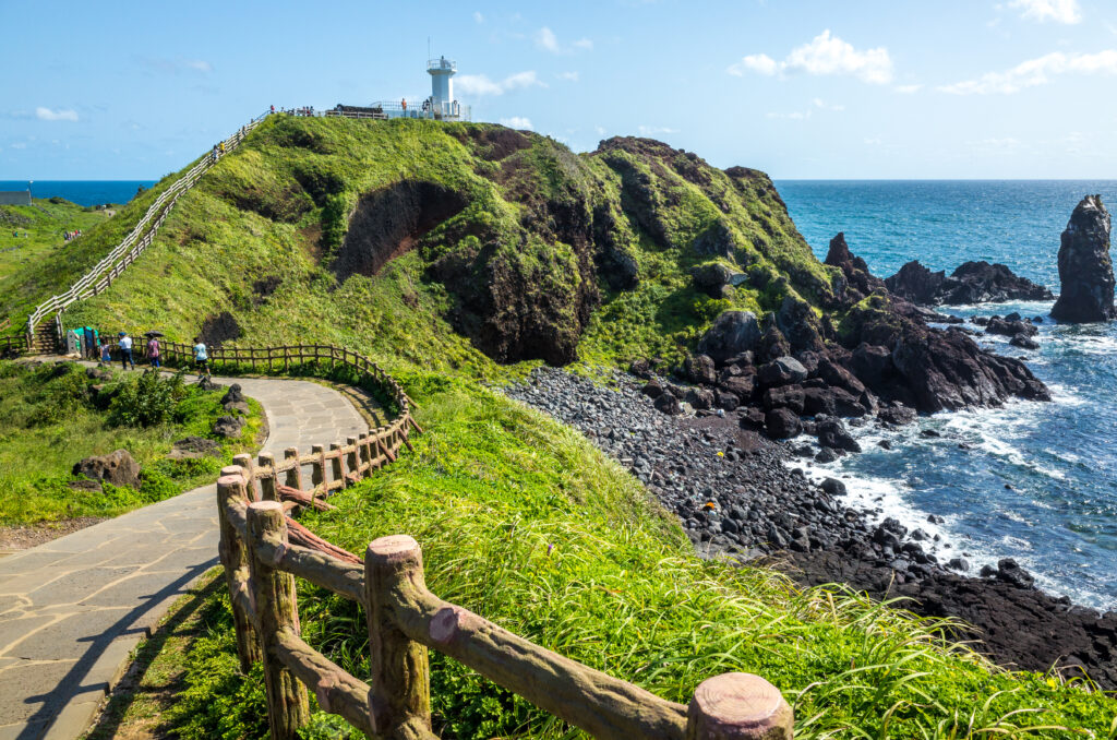 scenic view rocks by sea against sky